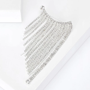 Detailed close-up of a luxury silver tassel brooch with sparkling rhinestones on white display
