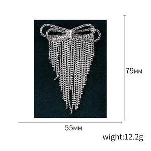 Elegant bowknot tassel brooch with sparkling rhinestones and cascading metal chains