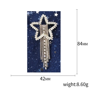 Exaggerated star tassel brooch with white rhinestones and champagne gems for women