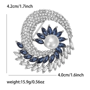 Detail of flower brooch showing blue marquise crystals and large pearl core with dimensions
