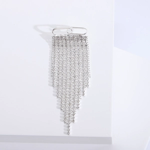 Elegant silver tassel brooch with rhinestone fringes on a minimalist white display