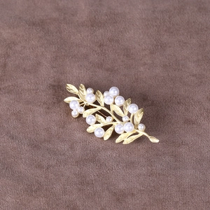 Elegant gold leaf branch brooch with white pearls for suits and coats accessory