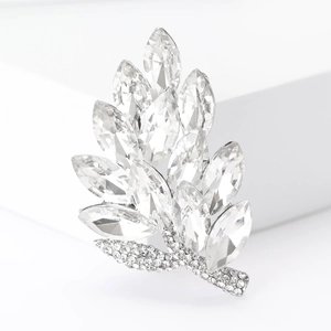 Macro shot of silver alloy leaf brooch with marquise-cut crystals and pavé rhinestones