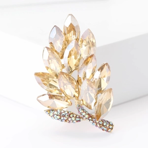 Elegant gold leaf brooch with champagne marquis crystals and rainbow rhinestones