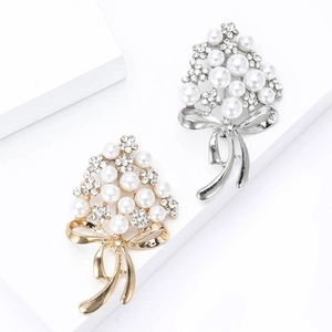 Sparkling rhinestone flower bouquet brooches with pearls and metallic bow in gold and silver