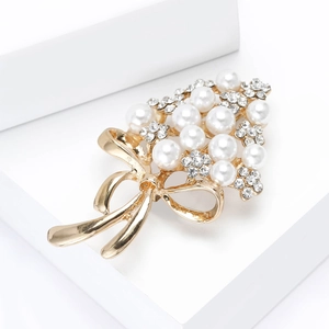 Exquisite gold floral brooch with faux pearls, rhinestones and a delicate bow detail