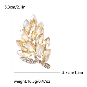 Elegant gold leaf brooch with champagne crystals and size measurements shown