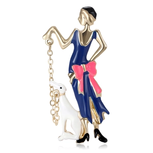 Art Deco style enamel brooch featuring a lady in blue dress walking a white hound dog