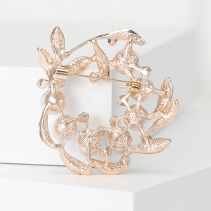 Elegant rose gold wreath brooch with pearls and textured pin clasp back view