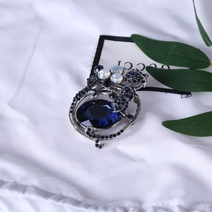 Vintage silver tulip brooch with large oval navy blue gemstone and cat eye beads