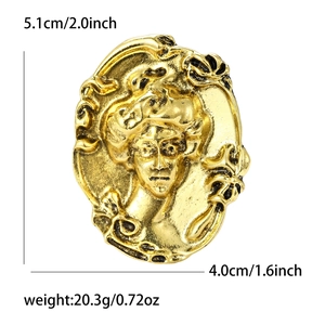 Vintage style gold portrait brooch with Victorian relief design and scrollwork frame