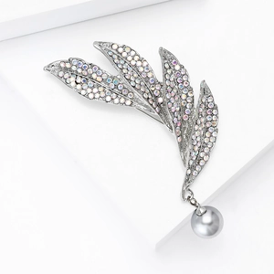 Detail of silver feather brooch with iridescent rhinestones and a grey pearl pendant