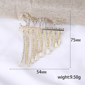 Broche SMILE dorée avec glands en strass et gemmes pour vestes de costume