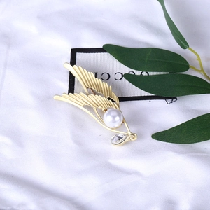 Elegant gold angel wing brooch with white pearl and teardrop crystal pendant for women