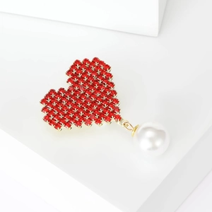 Elegant red heart brooch with crystals and pearl drop on minimalist white background