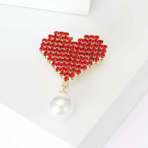 Elegant red heart rhinestone brooch with a hanging white pearl on a gold metal base