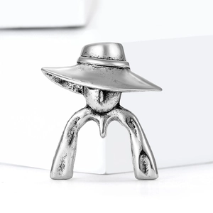 Vintage silver finish abstract woman portrait brooch with wide hat on white background