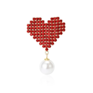 Elegant red rhinestone heart brooch with a large white pearl drop on white background