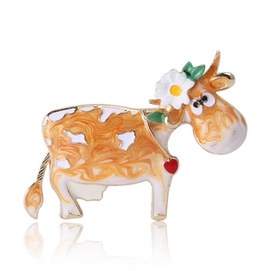 Cartoon cow brooch with floral and heart details, gold plated alloy in orange and white