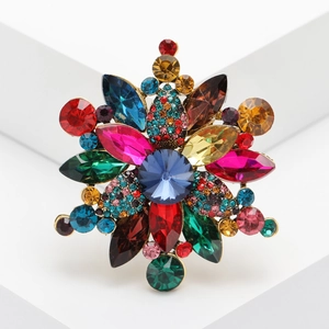 Elegant multi-color crystal brooch with blue centerpiece and colorful rhinestone accents