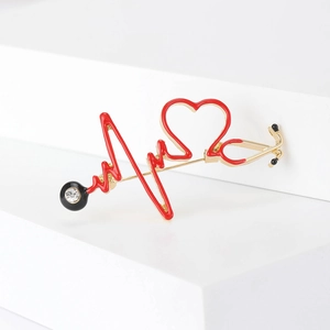 Broche stéthoscope créative en or avec battement de cœur en émail rouge et zircon