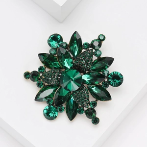 Elegant emerald green crystal flower brooch pin in gold plated setting for women