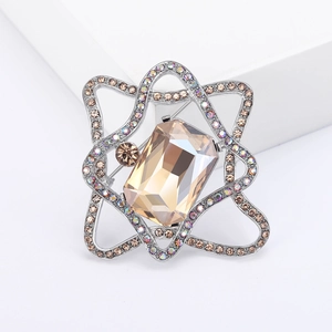 Elegant champagne crystal brooch with irregular silver frame and sparkling rhinestones