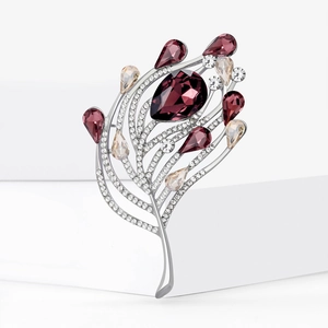 Broche élégante en forme de plume argentée avec pierres violettes et cristaux