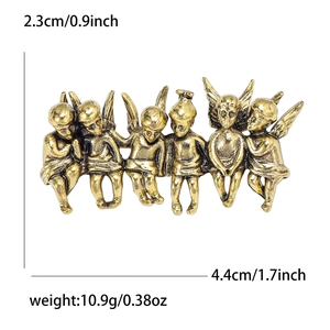 Macro view of vintage gold-toned angel brooch with precise size and weight dimensions
