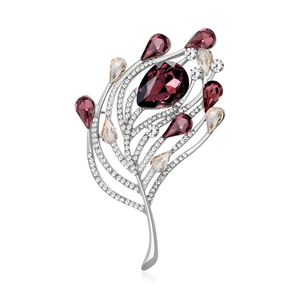 Broche en forme de plume avec base argentée, strass clairs et gemmes violettes