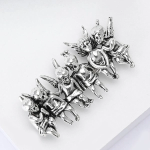 Detailed relief of six vintage silver cherubs on an alloy brooch for women's suits