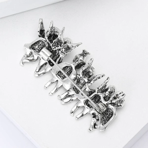Detail view of the secure pin clasp on back of retro silver angel brooch