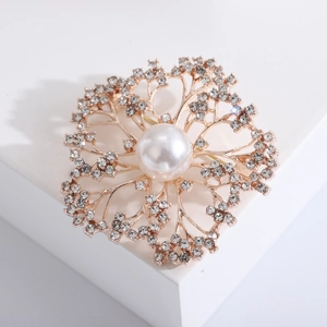 Elegant floral pearl brooch with sparkling rhinestones on a gold-plated base
