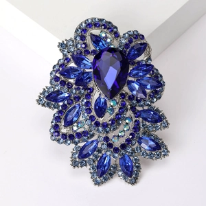 Detailed macro view of royal blue drop crystal brooch with elegant silver alloy plating