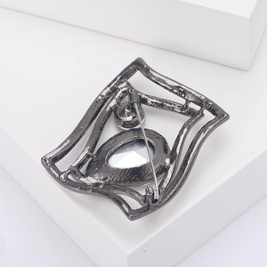 Minimalist black rhinestone geometric brooch showing back view with secure rotating pin clasp