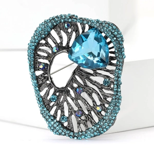 Macro view of a blue crystal brooch with branch texture and navy rhinestones