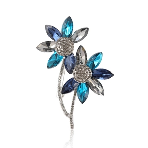 Elegant silver alloy brooch featuring twin blue crystal flowers with white diamonds