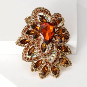 Exaggerated vintage amber crystal glass brooch with golden floral alloy base