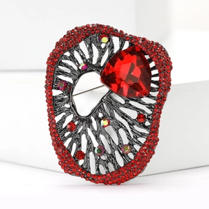 Vintage gun-black alloy brooch with large red triangle crystal and rhinestones