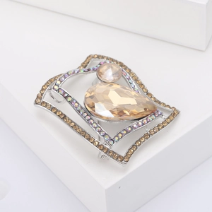 Detail of geometric brooch with champagne crystals and colorful rhinestones on silver base