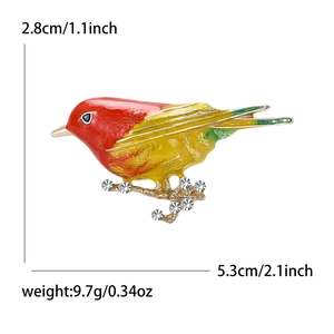Fashion bird brooch with colorful enamel on gold-tone branch and crystal accents