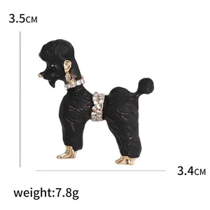 Detail view of a black poodle brooch with gold accents and sparkling crystal rhinestones
