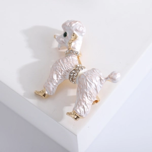 Exquisite white enamel poodle brooch with gold accents and sparkling crystals