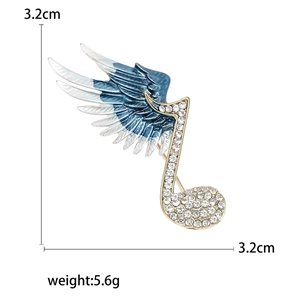 Note and wing brooch with blue gradient enamel and rhinestones on gold base, 3.2cm