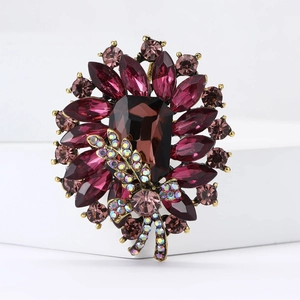 Macro detail of high-end alloy brooch with rectangle brown crystal and rhinestones