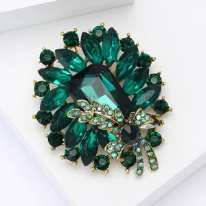 Vintage emerald crystal alloy brooch with a rectangular stone and marquise floral design