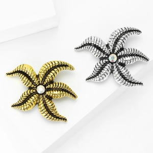 Starfish alloy suit lapel pins in gold and silver finish with iridescent rhinestone center