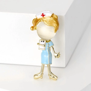 Detail of cartoon nurse brooch with gold frame, opal stone head and enamel uniform