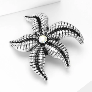 Detailed close-up of alloy starfish lapel pin with antique silver finish and center rhinestone