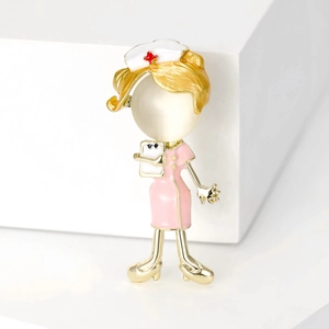Cute Japanese nurse brooch in gold alloy with pink enamel and a pearl-like round gem